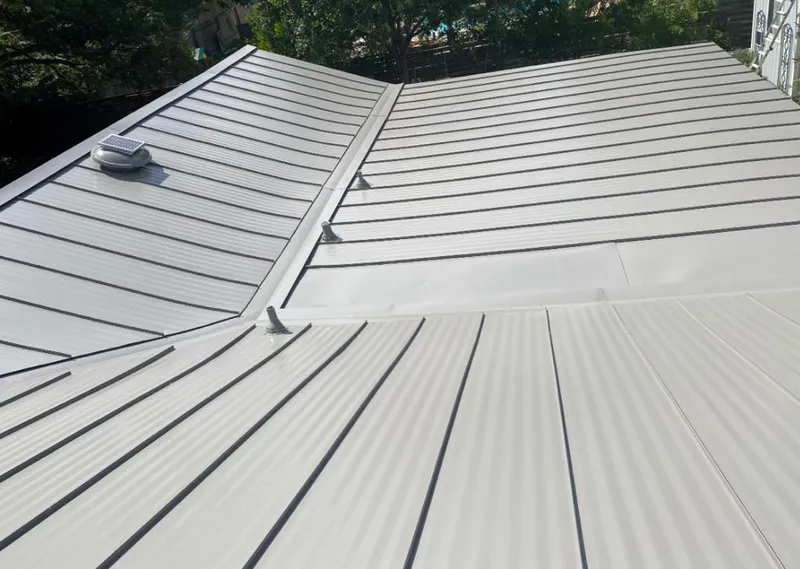 Solar attic fan installed on a metal roof for Roof Ventilation in Granite City